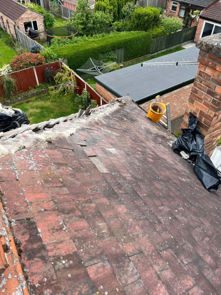 This is a photo of a roof where the hip tiles have been removed, and are just about to be replaced. Works carried out by Castle Donnington Roofing Repairs