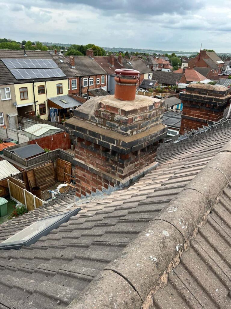 This is a photo taken from a roof which is being repaired by Castle Donnington Roofing Repairs, it shows a street of houses, and their roofs